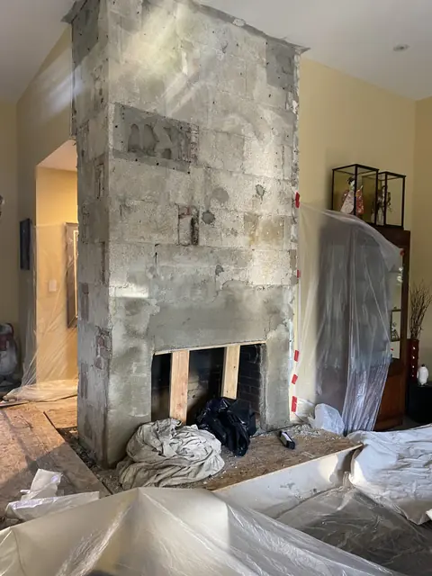 Alamo fireplace during the remodel with the old face removed