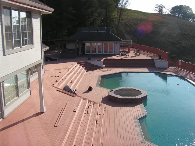New composite deck boards wrapping the pool and spa in Danville