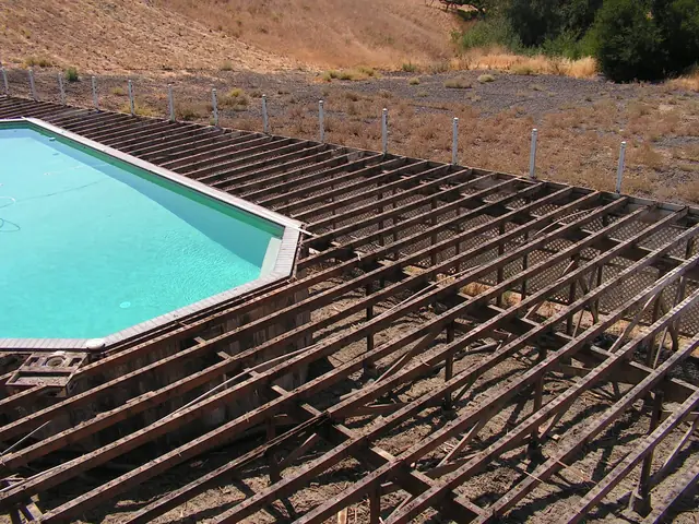 Bare deck framing around the pool after the old wood was stripped, Danville