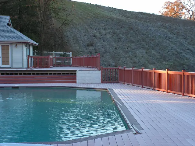 Pool and finished deck with new railing in Danville