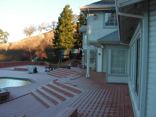 New deck steps leading down to the pool in Danville