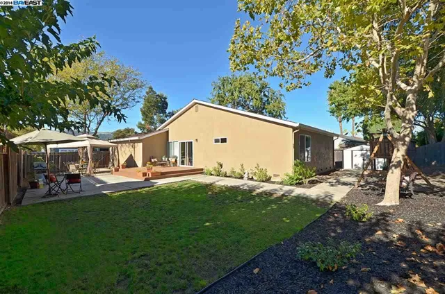 Back yard and rear of a home after an exterior makeover