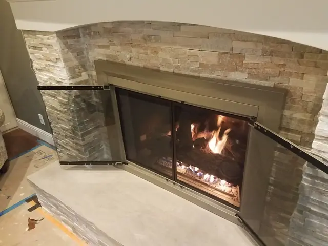 Close-up of the new stacked stone and fireplace insert