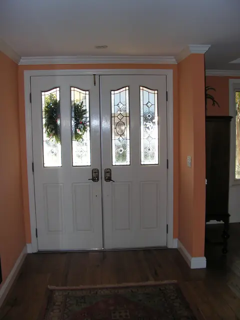 Before: the dated painted double door in the Danville entry