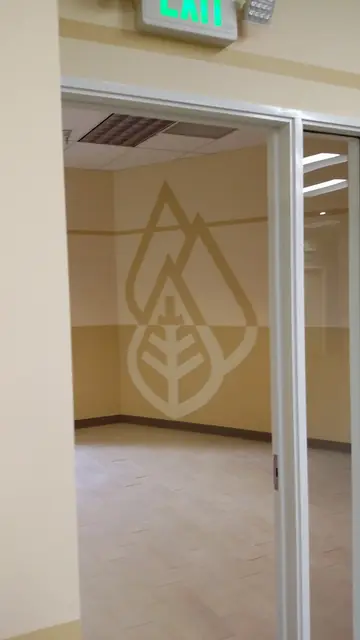 After: doorway into a room with the Huntington leaf logo, Danville