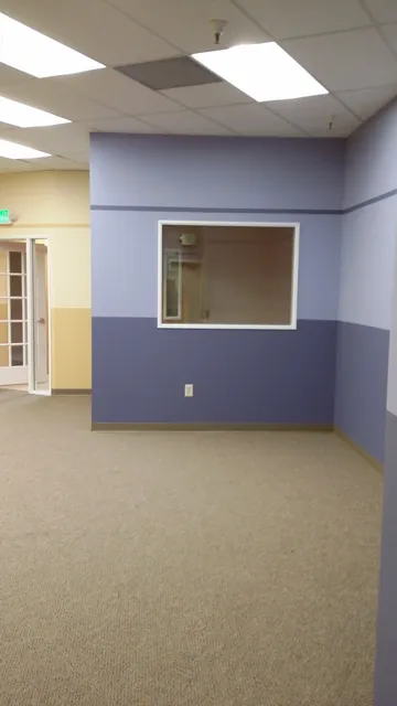 After: blue and tan rooms with an interior window at Huntington Learning Center in Danville
