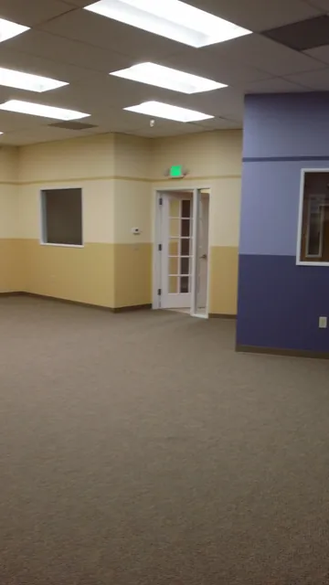 After: open area with glass-paneled doors and new paint at Huntington Learning Center in Danville