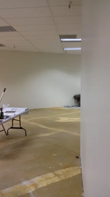Before: bare walls and a stripped floor in the Danville suite
