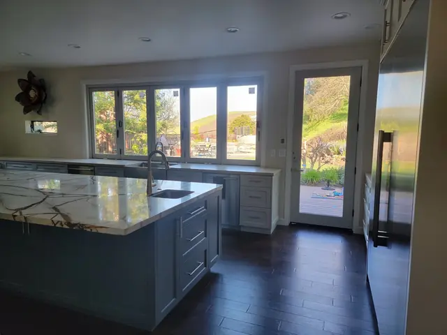 Blue island and garden windows in the remodeled kitchen
