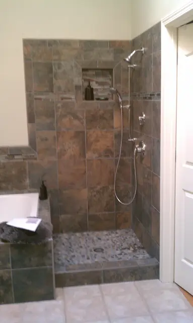 Walk-in shower with stone tile and a pebble floor, Livermore bathroom remodel