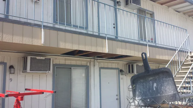 After: the Manteca apartment building from the ground, with the rebuilt balcony edge and walkway above