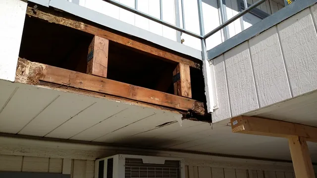 Before: second-floor balcony in Manteca opened up to show rotted, water-damaged framing