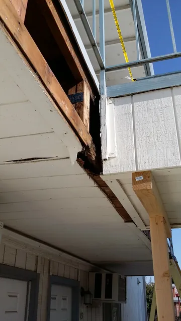 Before: walkway framing exposed at the corner of a Manteca apartment building