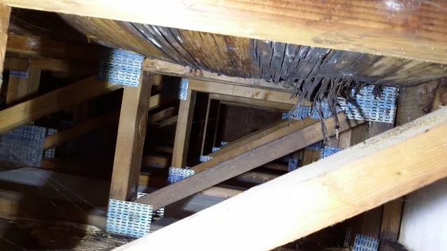 Before: damaged walkway joists seen from below at the Manteca apartments
