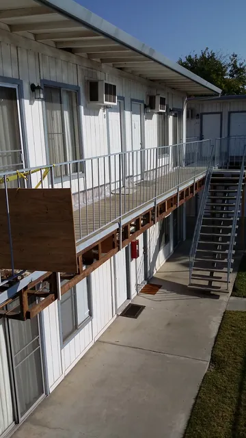 In progress: Manteca apartment building with the walkway edge still open during the repair