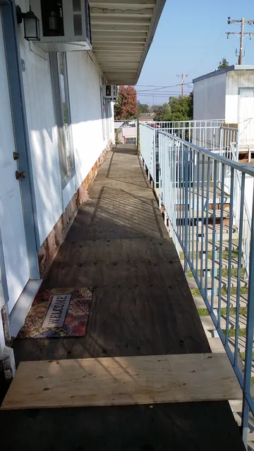 In progress: old walkway decking partly removed and new plywood going down at the Manteca apartments