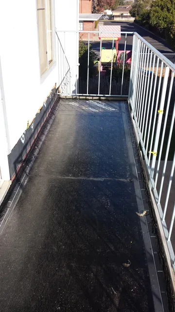 In progress: the Manteca walkway covered in a dark base coat, railings still up