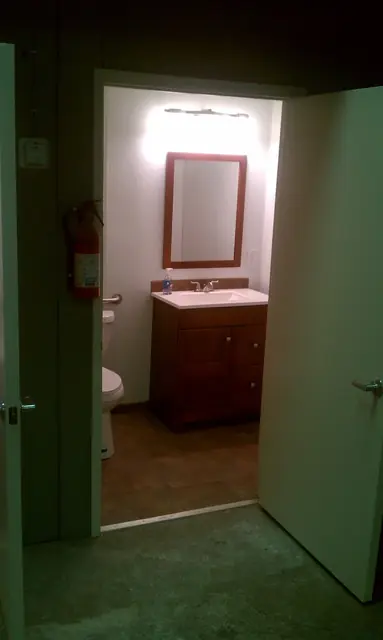 Restroom with a new vanity and mirror, San Leandro office tenant improvement