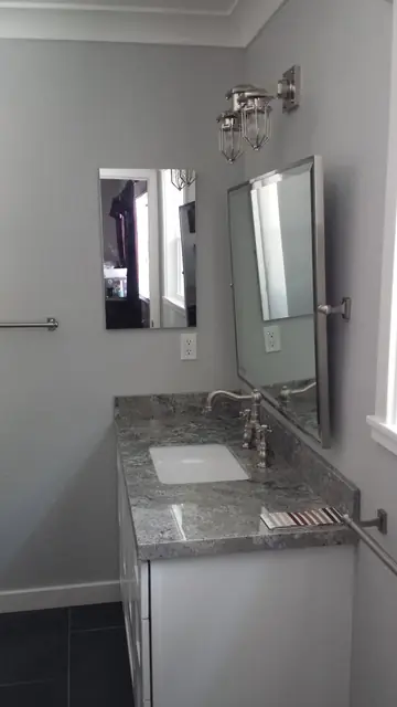 Vanity with granite top and new fixtures in the San Ramon bathroom