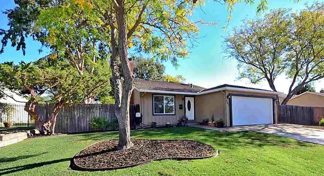 Front of the remodeled San Ramon home with a new driveway, walkway and garage door