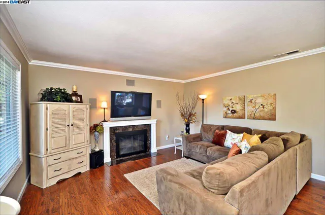 Remodeled living room in San Ramon with hardwood floors and a new fireplace mantel