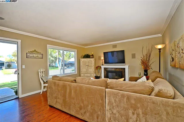 Living area of the San Ramon home remodel with new paint, moulding and hardwood