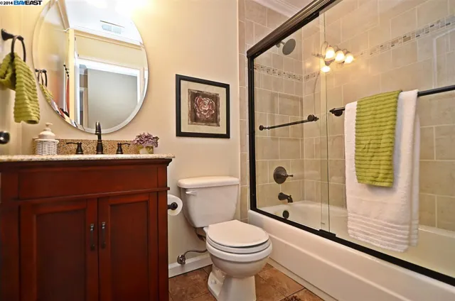 Remodeled bathroom in the San Ramon home with a tiled tub and shower