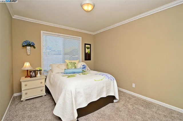 Bedroom with new carpet in the San Ramon whole-home remodel
