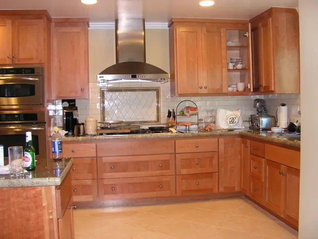 San Ramon kitchen remodel with hardwood cabinets and a stainless range hood