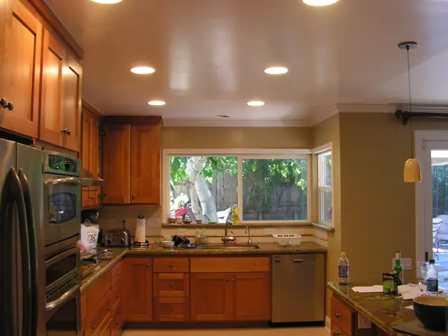 Remodeled San Ramon kitchen with hardwood cabinetry, recessed lighting and a new window