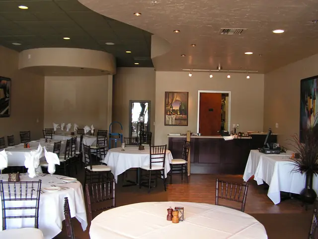 Finished banquet room at Zephyr Grill & Bar in Livermore, set with white tablecloths